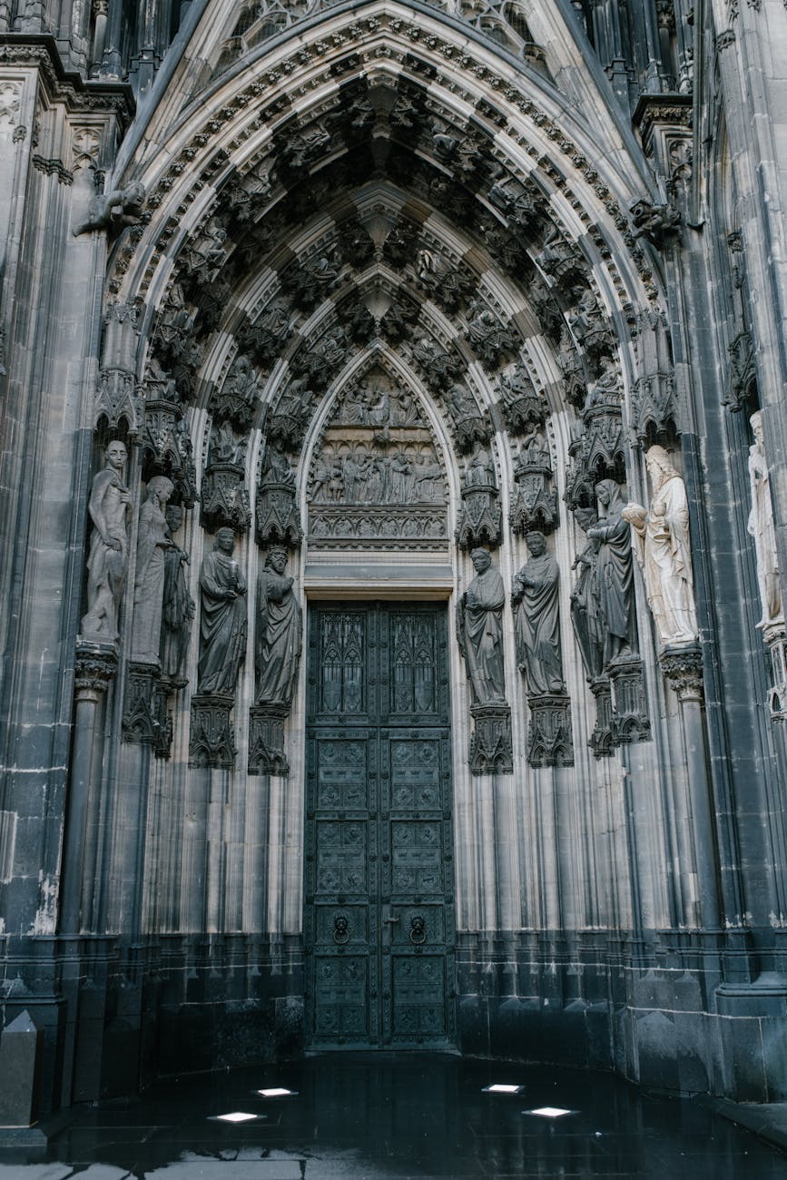 catholic cathedral door decorated with medieval statues